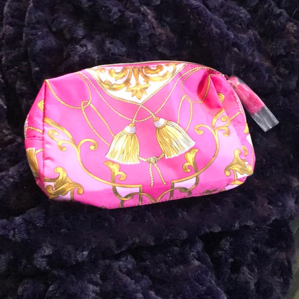 Beautiful pink print Estée Lauder cosmetic bag
NWOT